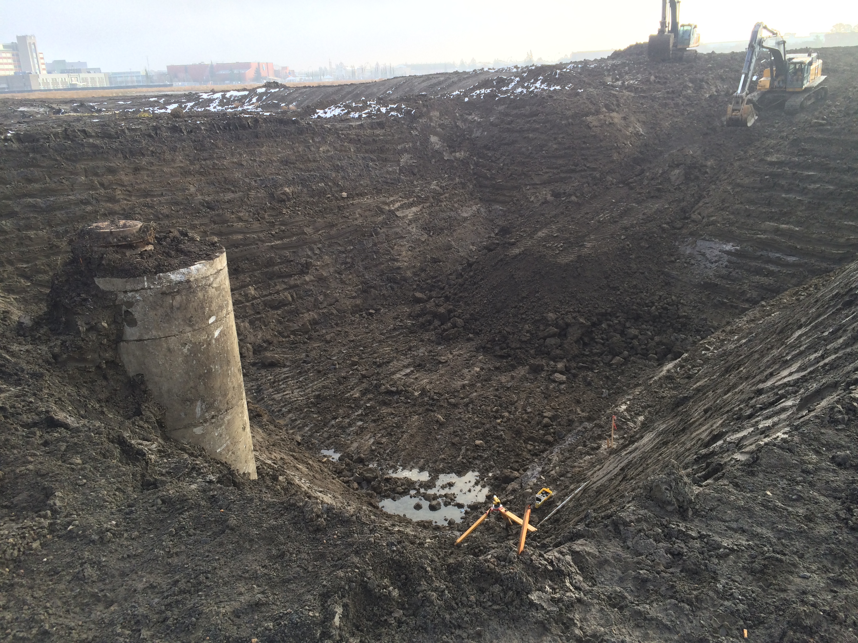 The vertical pipe is a manhole that connects to the existing sewer line. Crews are excavating to tie the new line into the existing combined sewer that currently runs across Blatchford. 