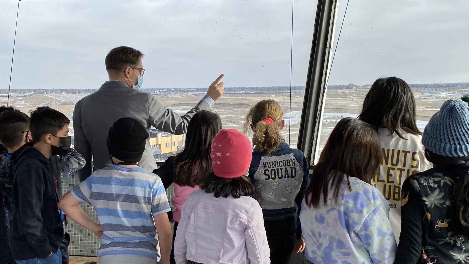 Crowd looking out from the control tower