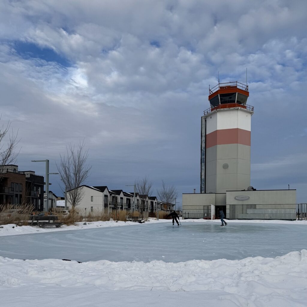 Two hockey players on Blatchford ice rink