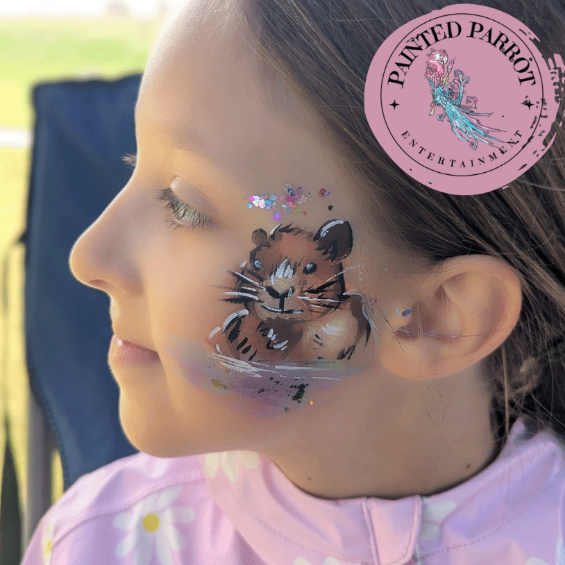 A young girl with a brown squirrel painted on her cheek